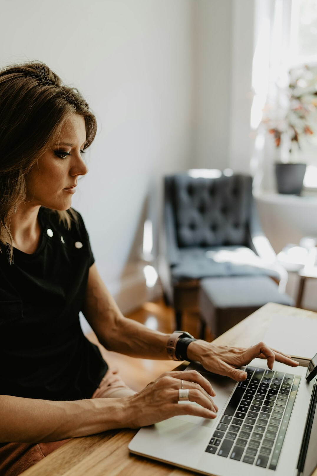 woman coding at home desk