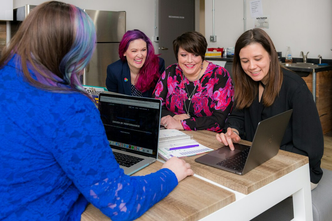 group of friends coding together